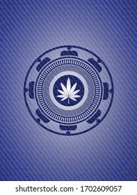 marijuana leaf icon inside emblem with denim texture. 
