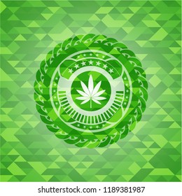marijuana leaf icon inside green mosaic emblem