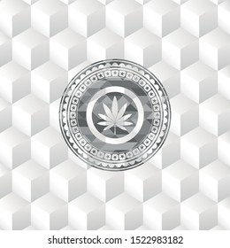marijuana leaf icon inside grey icon or emblem with geometric cube white background