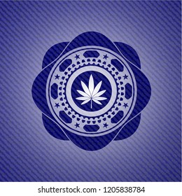 marijuana leaf icon inside jean or denim emblem or badge background