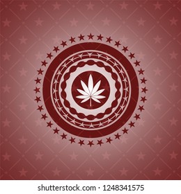 marijuana leaf icon inside red emblem