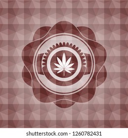 marijuana leaf icon inside red seamless emblem with geometric pattern background.
