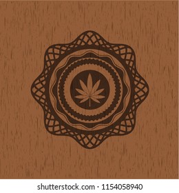 marijuana leaf icon inside retro wood emblem