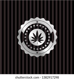marijuana leaf icon inside silvery badge or emblem