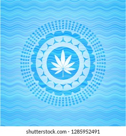 marijuana leaf icon inside sky blue water emblem.