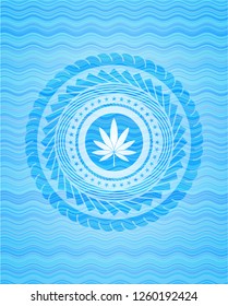 marijuana leaf icon inside water style emblem.