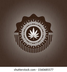 marijuana leaf icon inside wood emblem