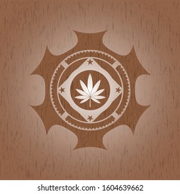 marijuana leaf icon inside wood emblem. Vintage.
