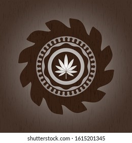 marijuana leaf icon inside wood emblem