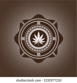 marijuana leaf icon inside wooden emblem. Vintage.