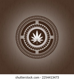Marihuana-Blattsymbol im Holzemblem. Jahrgang. 