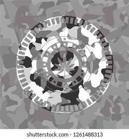 marijuana leaf icon on grey camouflage texture