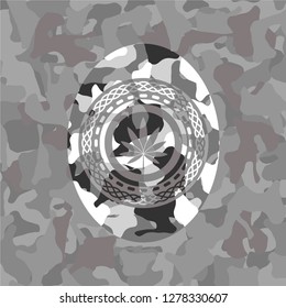 marijuana leaf icon on grey camouflage pattern