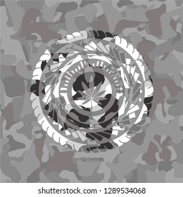 marijuana leaf icon on grey camo texture