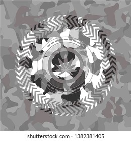 marijuana leaf icon on grey camouflaged texture