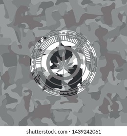 marijuana leaf icon on grey camo pattern