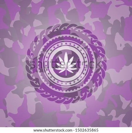 marijuana leaf icon on pink camouflage pattern
