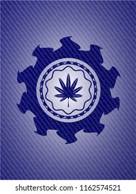 marijuana leaf, weed icon inside badge with denim texture