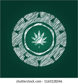 marijuana leaf, weed icon inside chalkboard emblem on black board