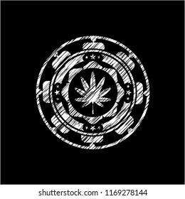 marijuana leaf, weed icon inside chalkboard emblem written on a blackboard