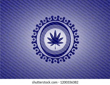 marijuana leaf, weed icon inside emblem with jean background