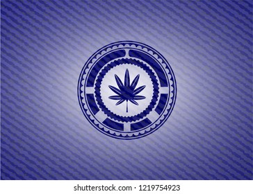 marijuana leaf, weed icon inside emblem with jean high quality background