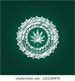 marijuana leaf, weed icon inside chalkboard emblem on black board