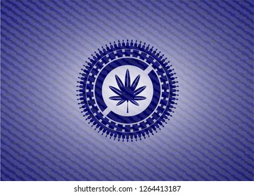 marijuana leaf, weed icon inside emblem with jean background