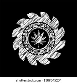 marijuana leaf, weed icon inside chalk emblem written on a blackboard