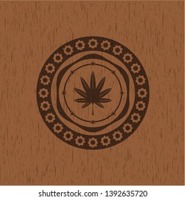 marijuana leaf, weed icon inside retro style wood emblem