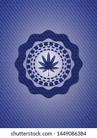 marijuana leaf, weed icon inside emblem with denim texture