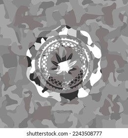 marijuana leaf, weed icon inside grey camouflaged emblem. 