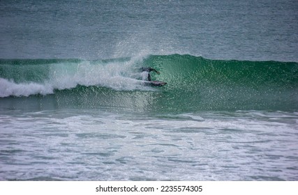 marine background with man surfing