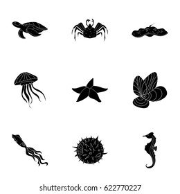 Marine and river inhabitants. Fish, whales, octopuses.Sea animals icon in set collection on black style vector symbol stock illustration.