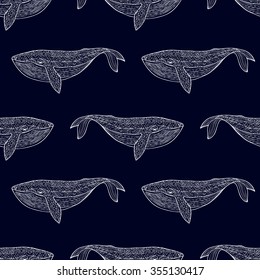 Marine seamless pattern. Repeating pattern of a flock of whales, fish, mammals swim each other. Picture painted by hand. White whale silhouette on a dark blue background. Vector. Package design.