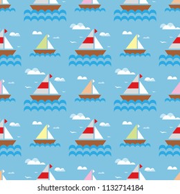 Marine seamless pattern. Sailing boats with colored sails on a blue background.