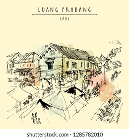Market place in Luang Prabang, Laos, Southeast Asia. French colonial buildings on the background. Vintage hand drawn touristic postcard in vector