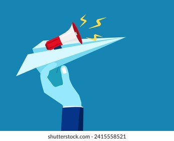 Marketing and advertising. Hand holding a megaphone on a paper plane 