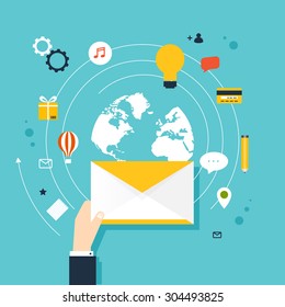 Marketing concept of running email campaign, email advertising, direct digital marketing. Human hand holding an envelope spreading information. 