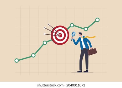 Marketing target audience research, business analysis to increase sale, target group or focused customer concept, businessman marketer holding magnifying glass analyze customer data graph and chart.