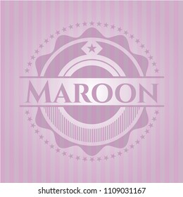 Maroon badge with pink background