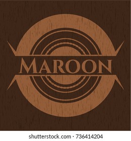 Maroon badge with wood background