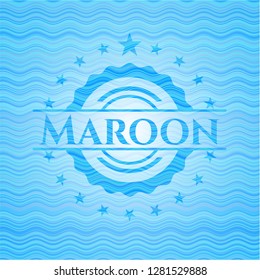 Maroon water wave badge.