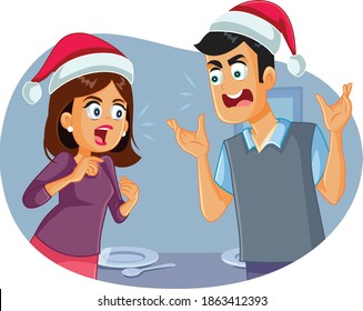 Married Couple Arguing at Christmas Table. Husband and wife fighting in loud voice on winter holidays 
