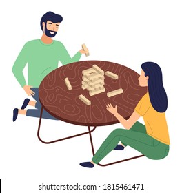 Married couple plays at table Jenga Tower. Wooden sticks, whetstones. Pull blocks. Development of attention and perseverance. Game from Tanzania. Children's wooden cubes. Board game, home fun
