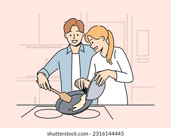 Married couple prepares breakfast enjoying sunday morning and experiencing happiness from communicating with loved one. Happy couple of man and woman cooking pancakes or omelet together svg