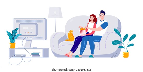 Married couple watching a movie on a big screen sitting on a sofa at home. Self-isolation at home.