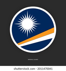Marshall Islands circle flag with white border on dark grey background. Marshall Islands button flag isolated on barely dark background.
