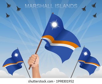 Banderas de las Islas Marshall ondeando bajo el cielo azul