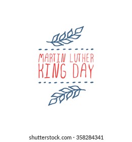 Martin Luther King Day handdrawn greeting card on white background.  Typographic banner with text and olive branch. Vector handdrawn badge.